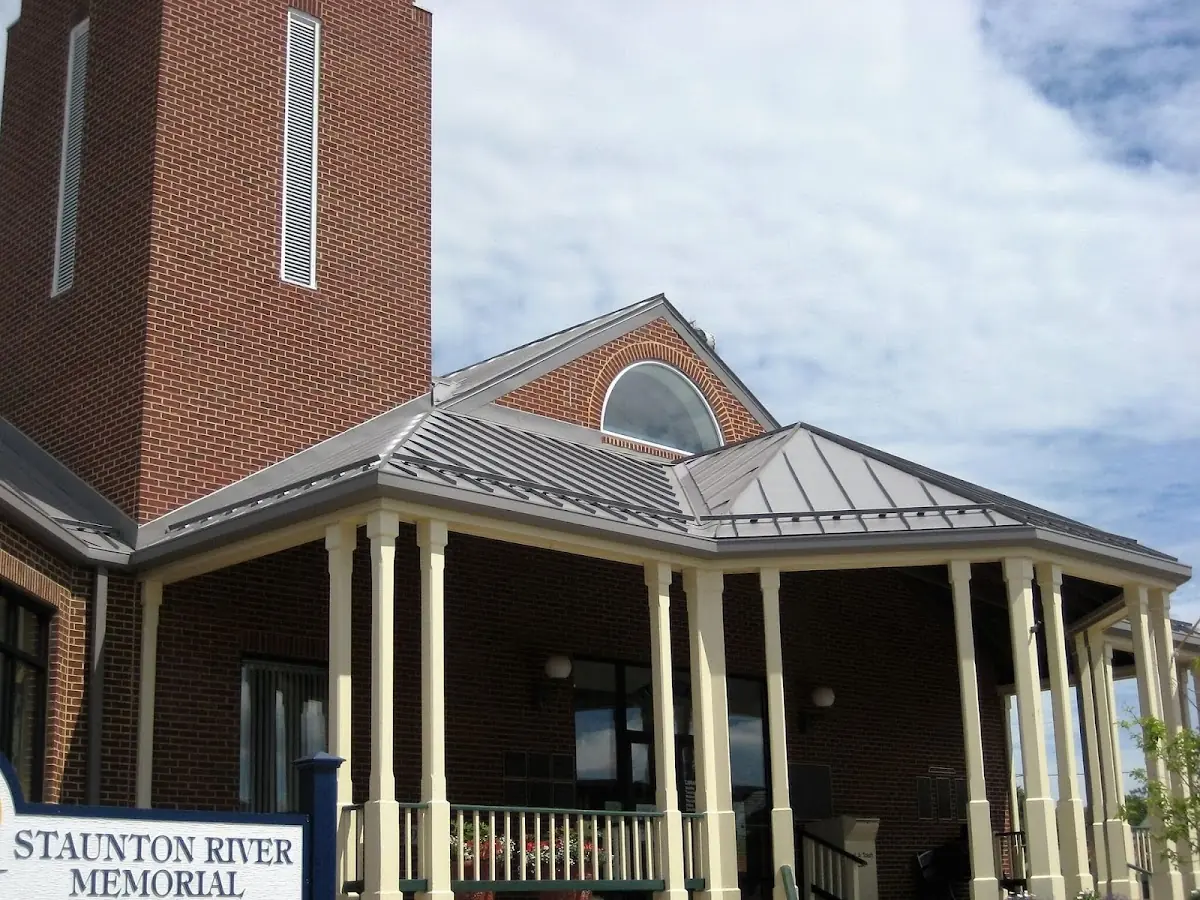 Skilled roofing craftsmen working on a residential roof in Morris
